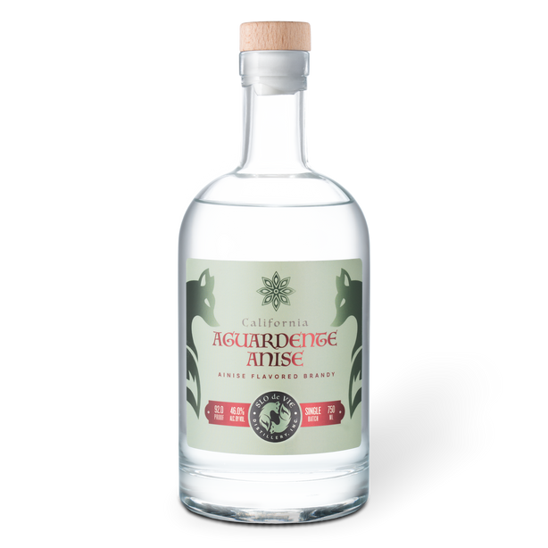 Clear bottle of Aguardente Anise with a green label on a white background