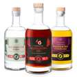 Three bottles of California Aguardente with different flavors on a white background