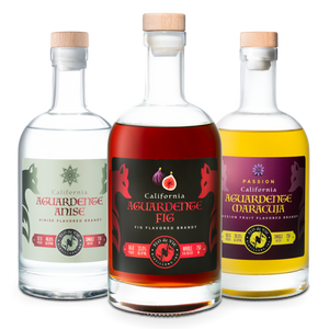 Three bottles of California Aguardente with different flavors on a white background