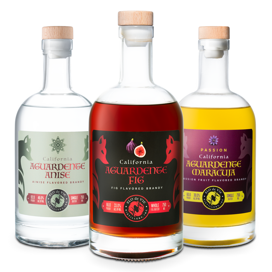 Three bottles of California Aguardente with different flavors on a white background